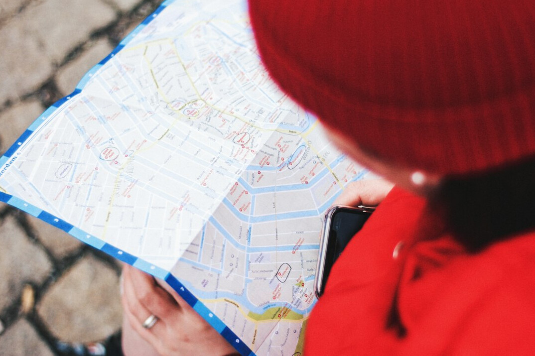 detective reading clues on map