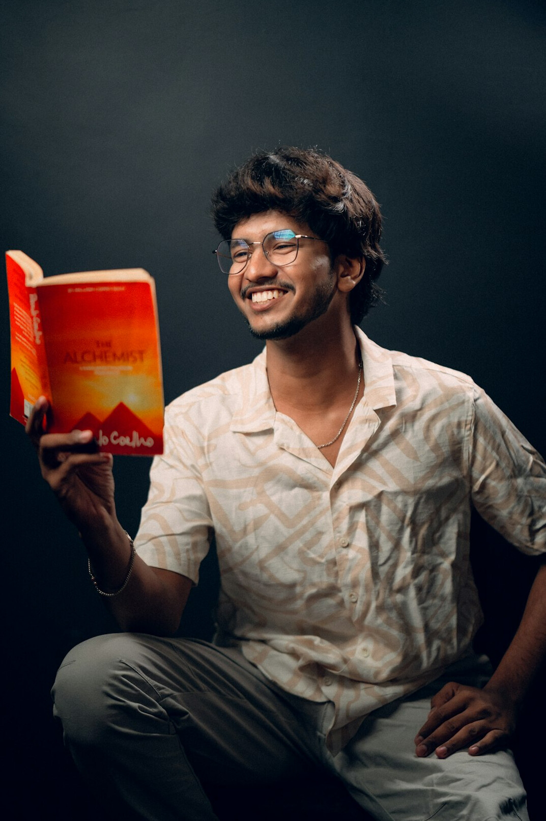 young author holding finished book