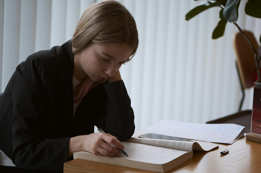 young writer at desk with notebook