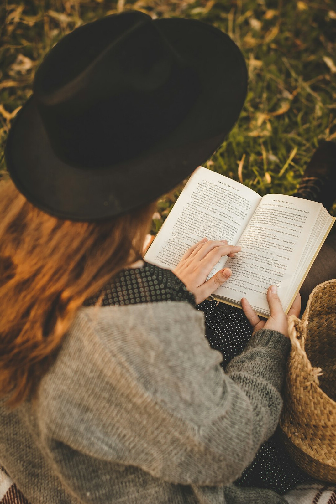 person reading mystery book
